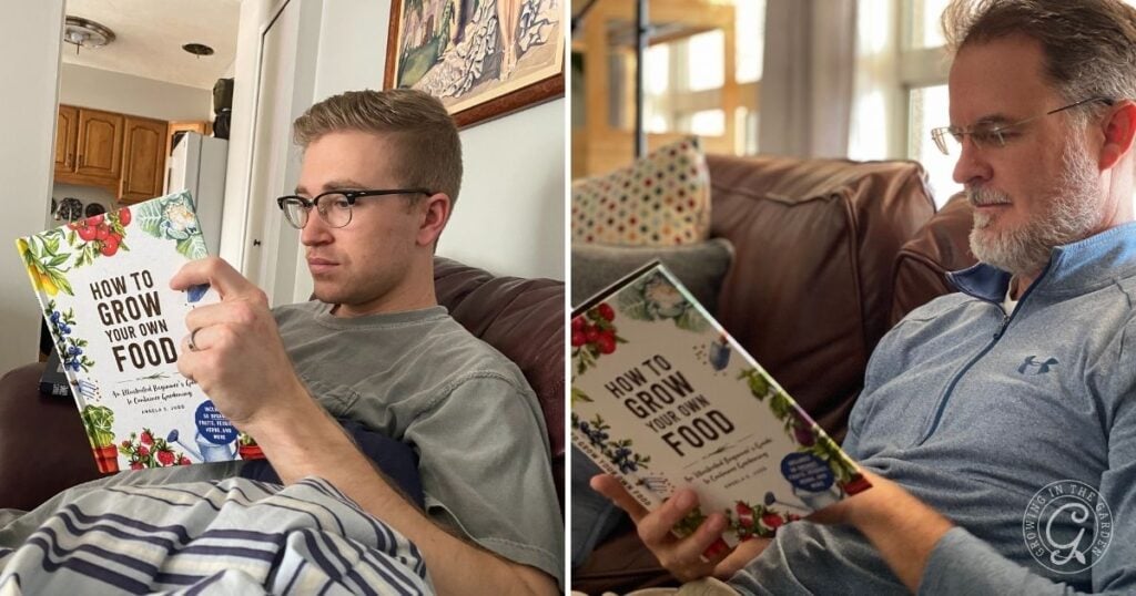 Two men sit indoors on couches, each deeply engrossed in reading How to Grow Your Own Food, eager to learn practical tips on how to grow your own food at home.