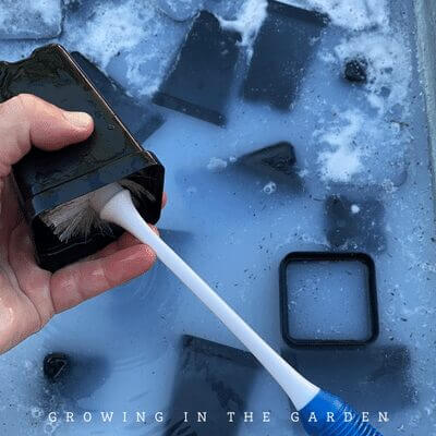 Submerge the containers and use the sponge or brush to scrub and dislodge all the dirt and debris. (Rinsing alone usually isn't enough to get the dirt and soil off.)